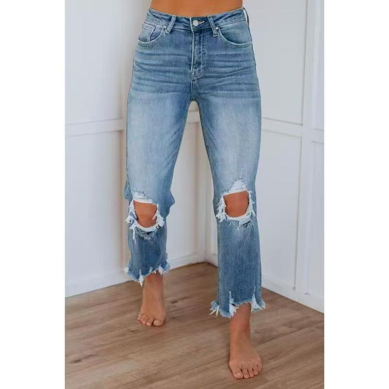 Medium blue washed slim-fit ripped jeans with side knee rips and frayed cuffs