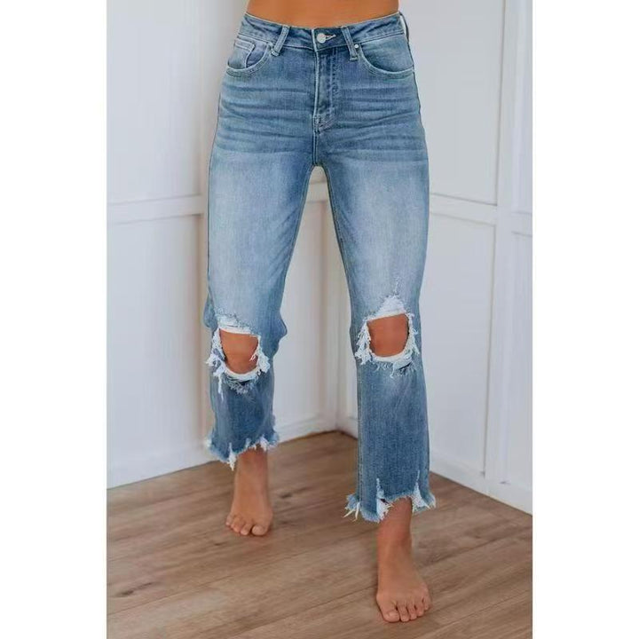 Medium blue washed slim-fit ripped jeans with side knee rips and frayed cuffs