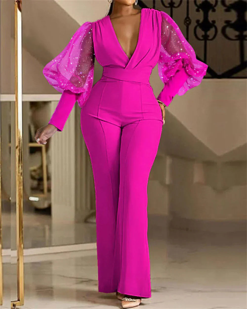 Pink embellished wrap-front jumpsuit with sheer puff sleeves and long flare legs