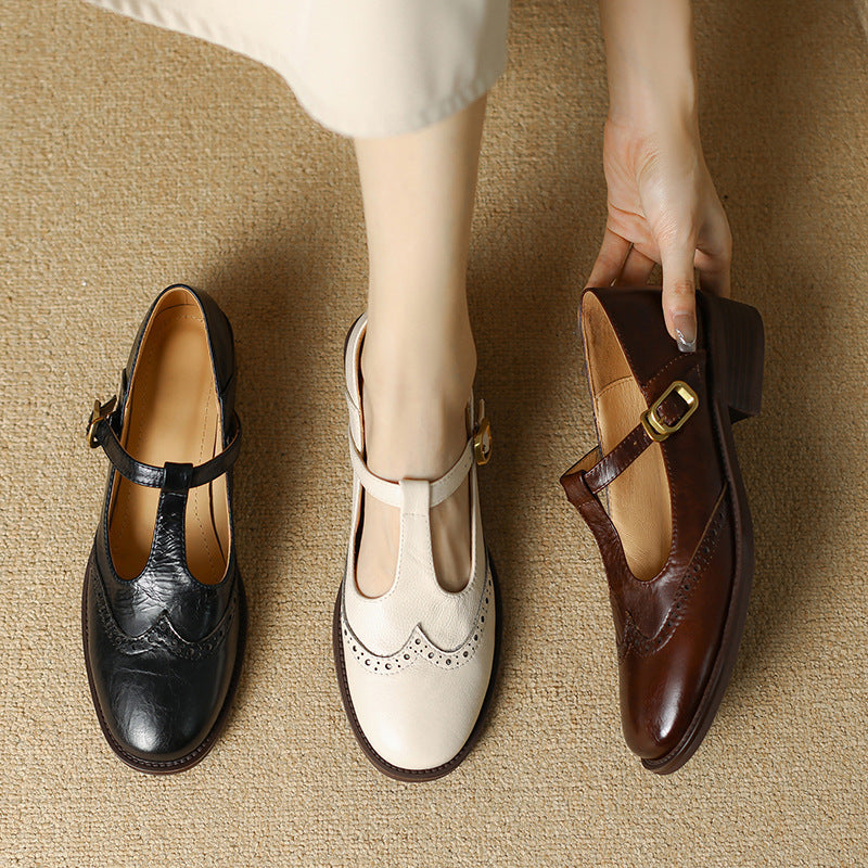 Mary Jane shoes shown in black, off-white, and dark brown with buckle straps