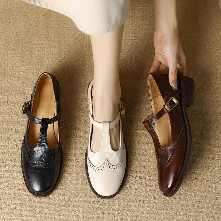 Mary Jane shoes shown in black, off-white, and dark brown with buckle straps