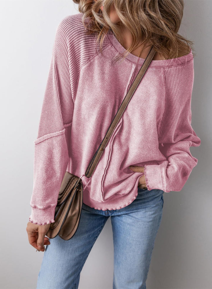 Pink crew neck long-sleeve sweatshirt with ribbed cuffs and hem