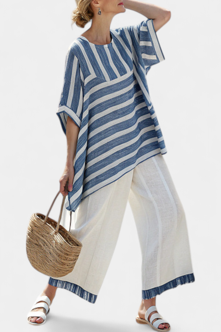 Blue-and-white striped top with split cuff hem, with white trousers and blue hem trim