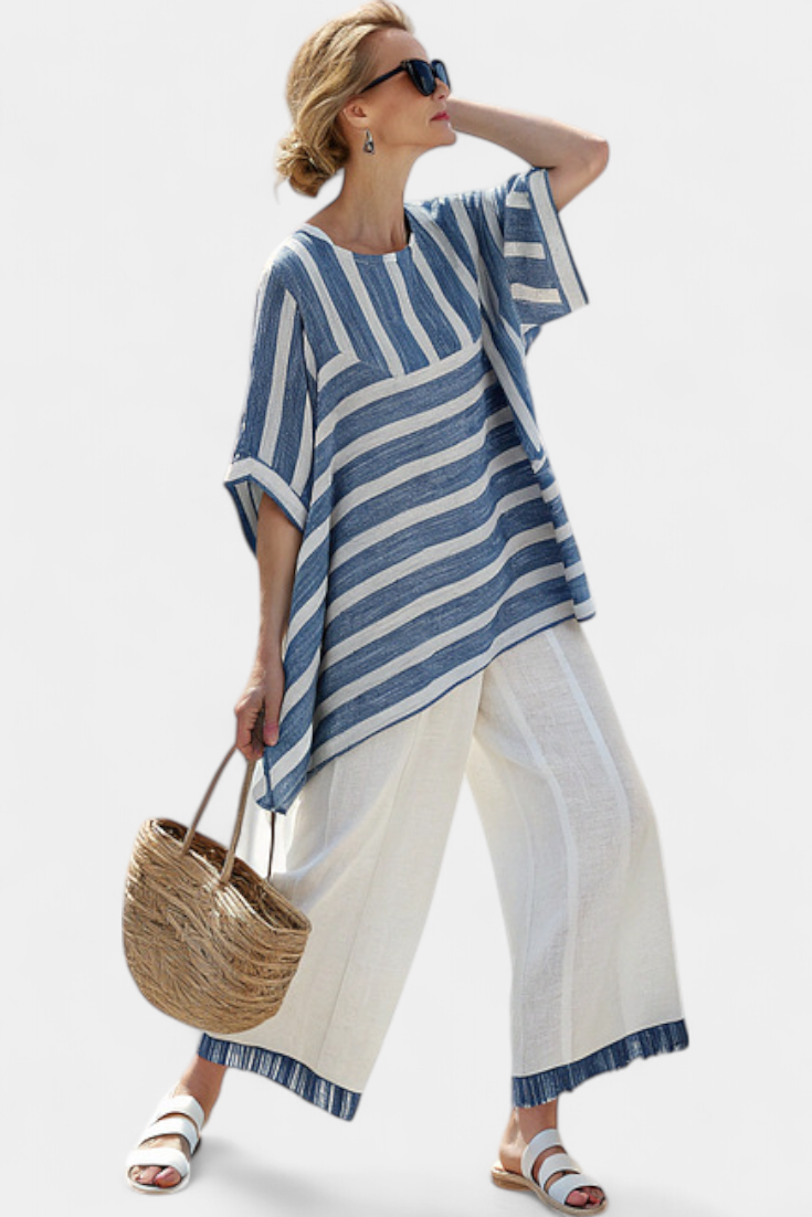 Blue-and-white striped top with split cuff hem and white trousers with blue ankle trim