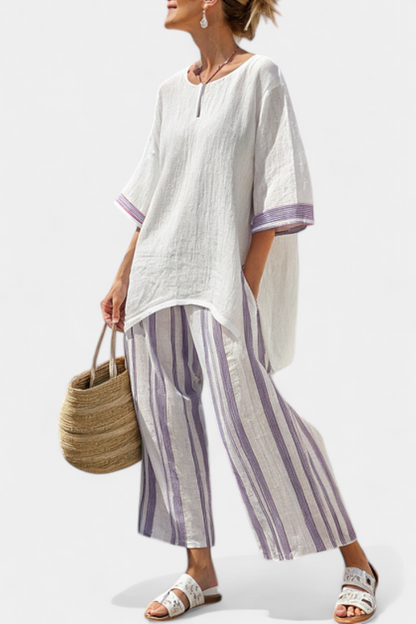 Relaxed shirt and striped trousers set: white tunic with keyhole neckline, purple cuff trim, striped pants