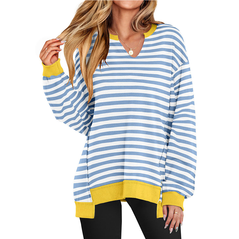 Oversized long-sleeve top in light blue and white stripes with yellow contrast cuffs