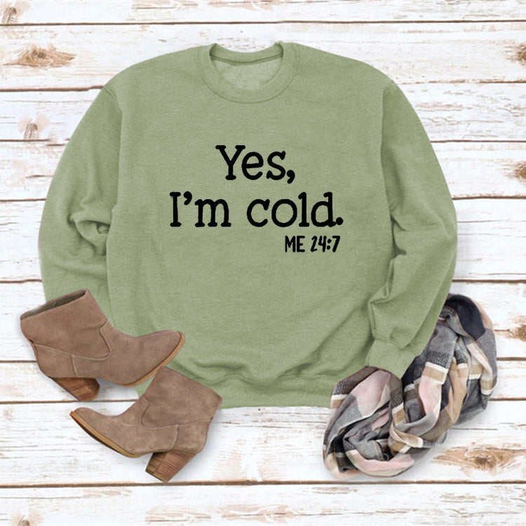 Olive green pullover sweatshirt with 'Yes, I'm cold.' ME 24:7 slogan print
