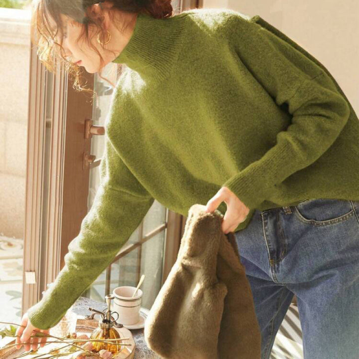 Light green turtle-neck long-sleeve sweater with ribbed collar and cuffs