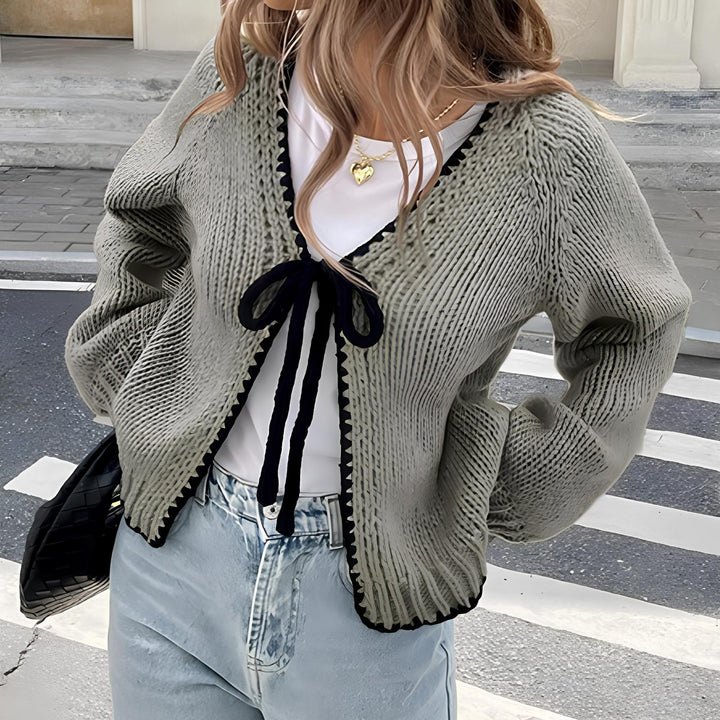 Gray open-front long sleeve cardigan with scalloped edge and black ribbon tie