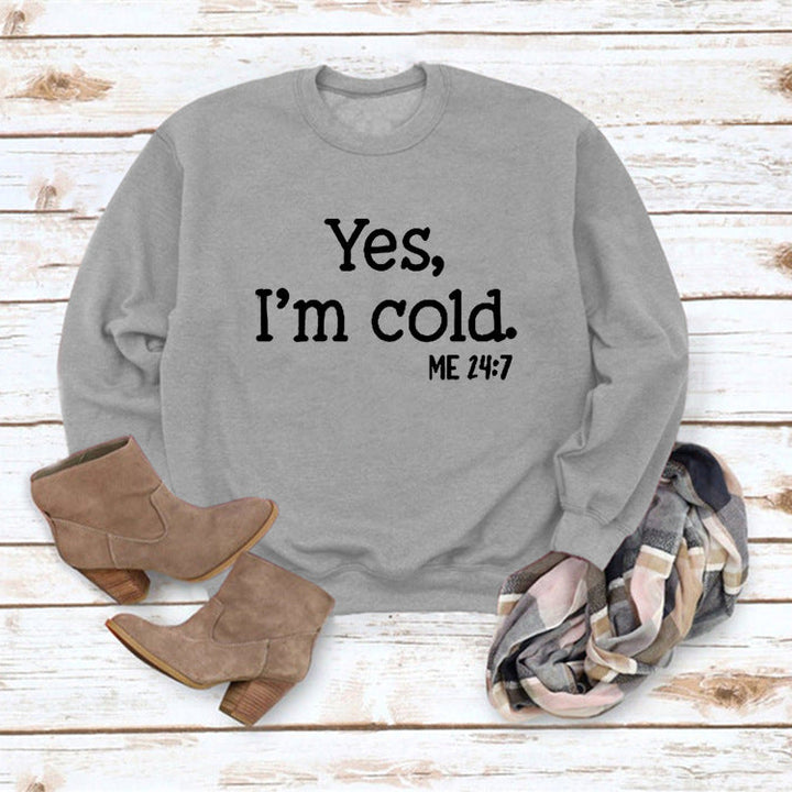 Grey pullover sweatshirt with 'Yes, I'm cold.' ME 24:7 slogan print