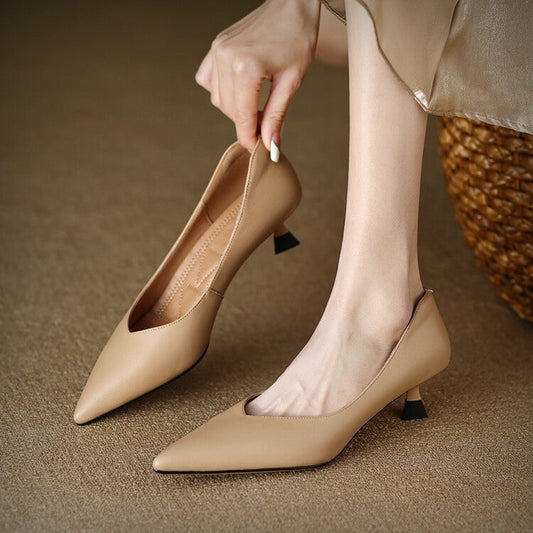 Beige pointed-toe pumps with small block heel and slingback strap