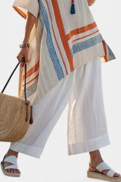 White wide-leg linen trousers with relaxed drape