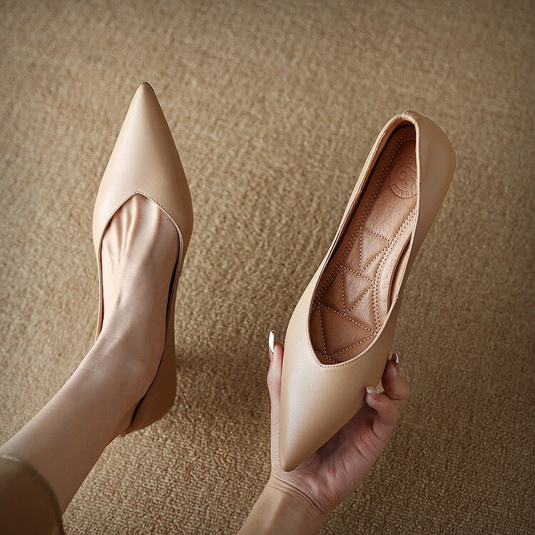 Beige pointed-toe pumps, one shown with quilted insole