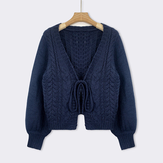 Blue cable-knit tie-front chunky cardigan with V-neck, long sleeves, and drawstring