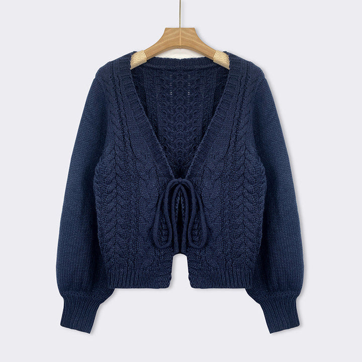 Blue cable-knit tie-front chunky cardigan with V-neck, long sleeves, and drawstring