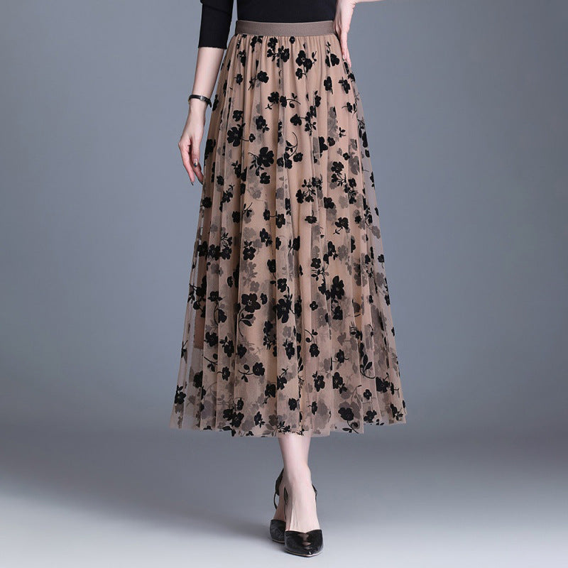 Coffee-tone floral midi skirt with black flower print, elastic waistband, flowing tiered hem