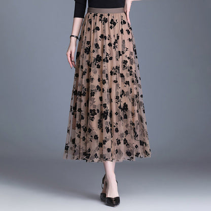 Coffee-tone floral midi skirt with black flower print, elastic waistband, flowing tiered hem