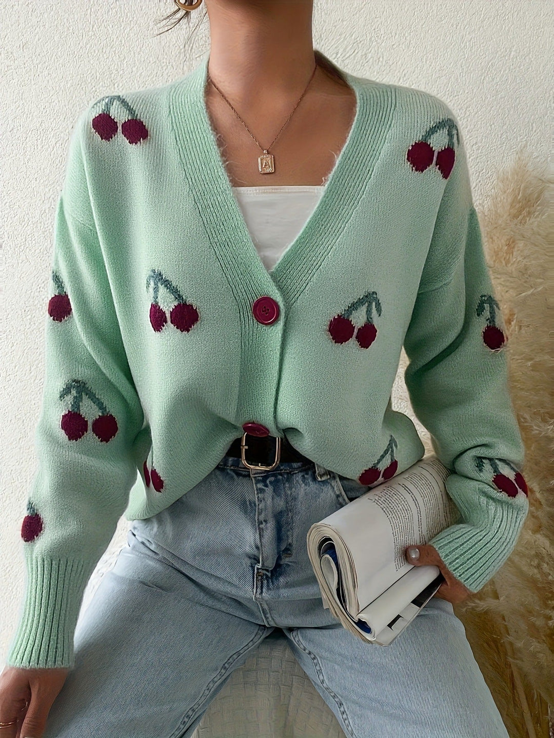 Light green button-front long-sleeve cardigan with red cherry print and V-neck