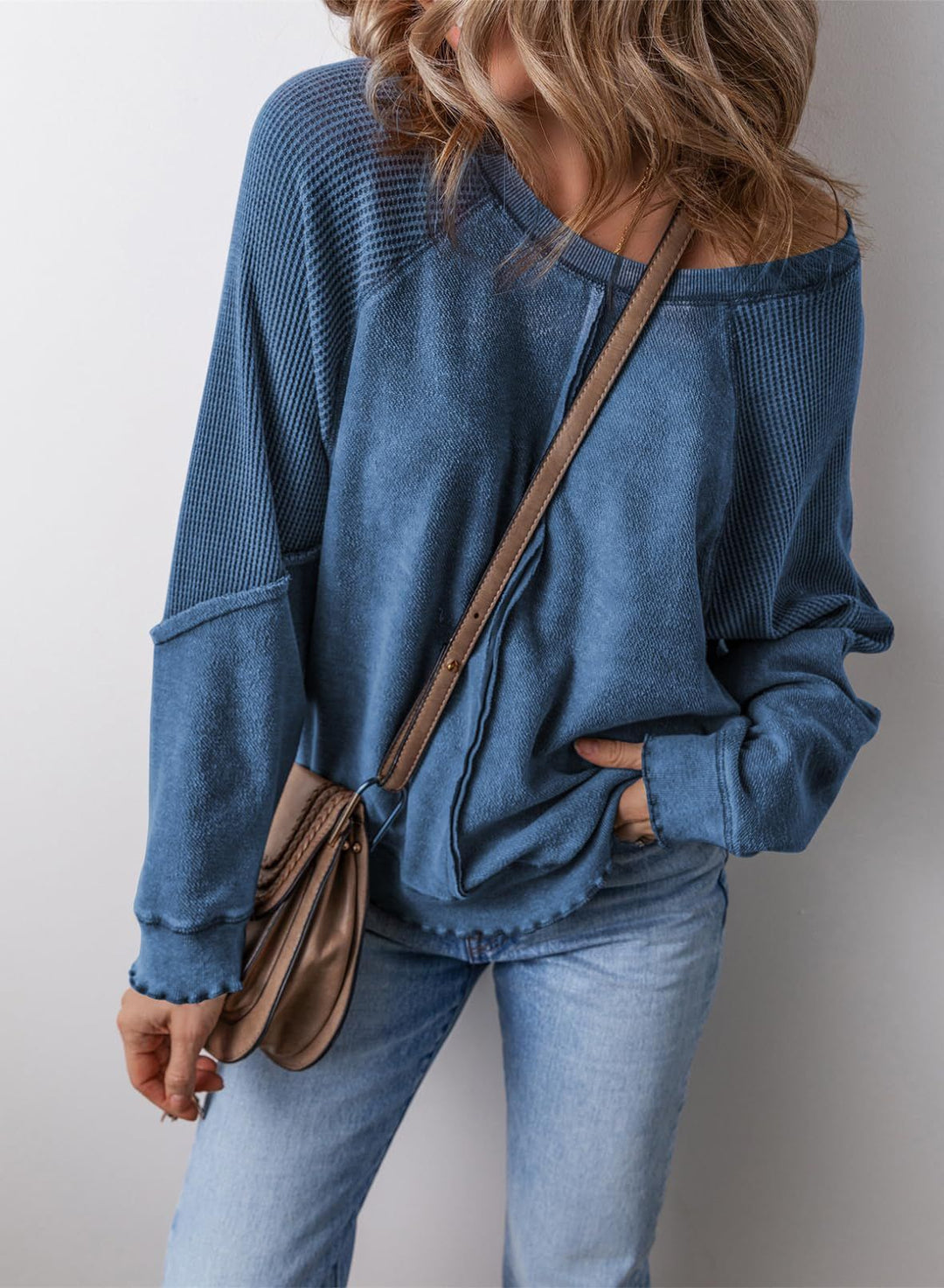 Blue crew neck long-sleeve sweatshirt with ribbed cuffs and hem