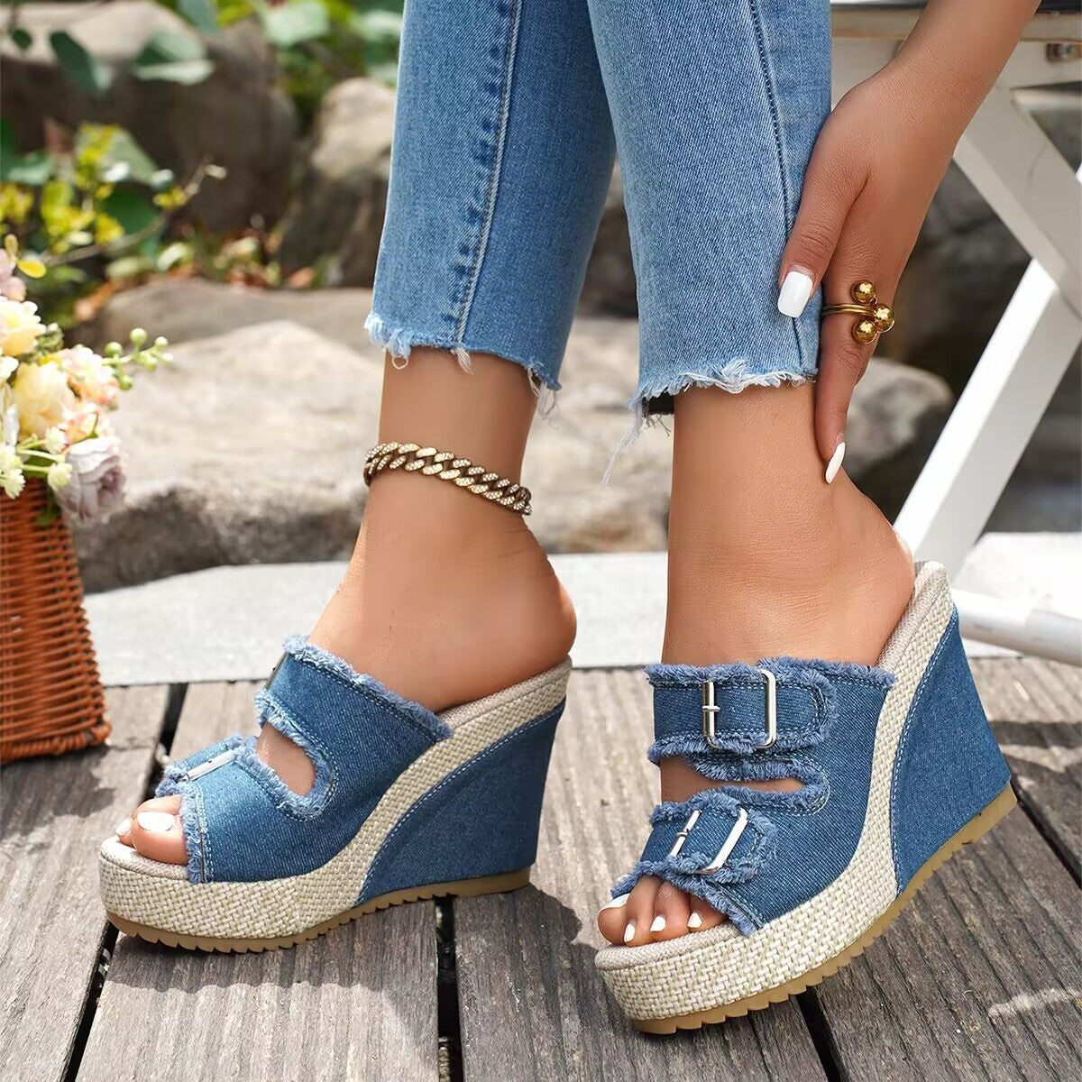 Blue denim platform wedge sandals with two buckle straps and open-toe design