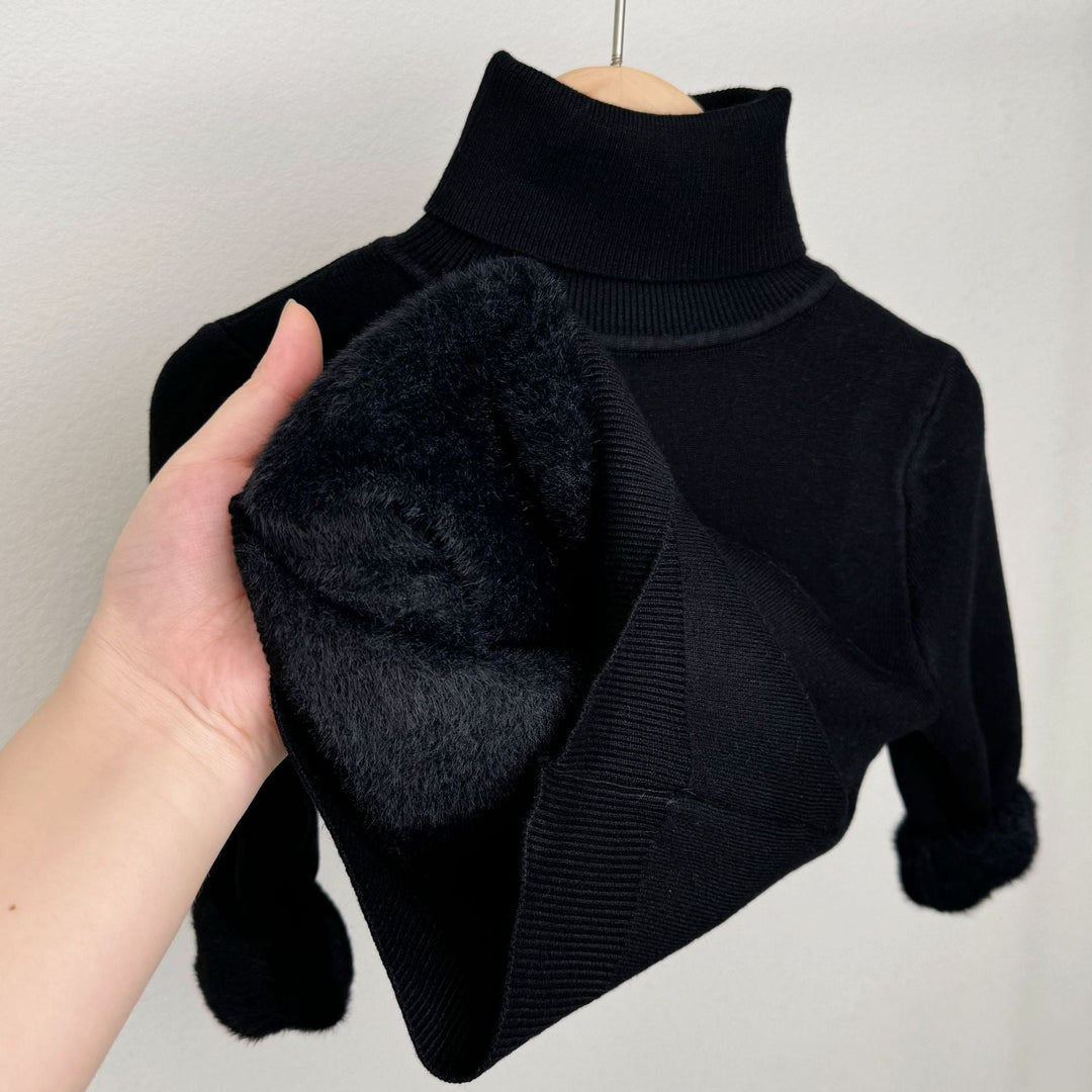 Black fleece-lined knit sweater with ribbed turtleneck; plush lining visible at cuff