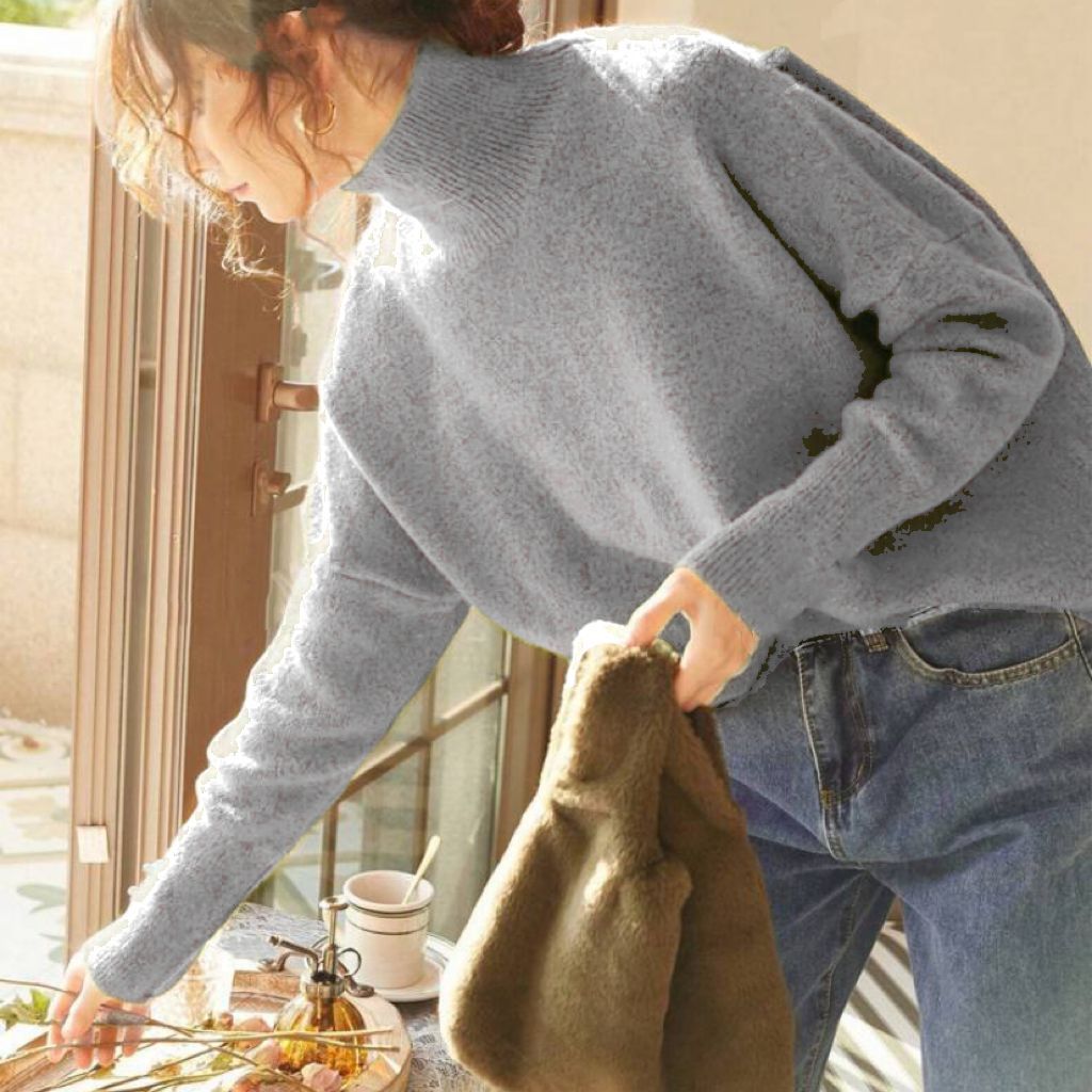 Light gray turtle-neck long-sleeve sweater with ribbed collar and sleeve cuffs