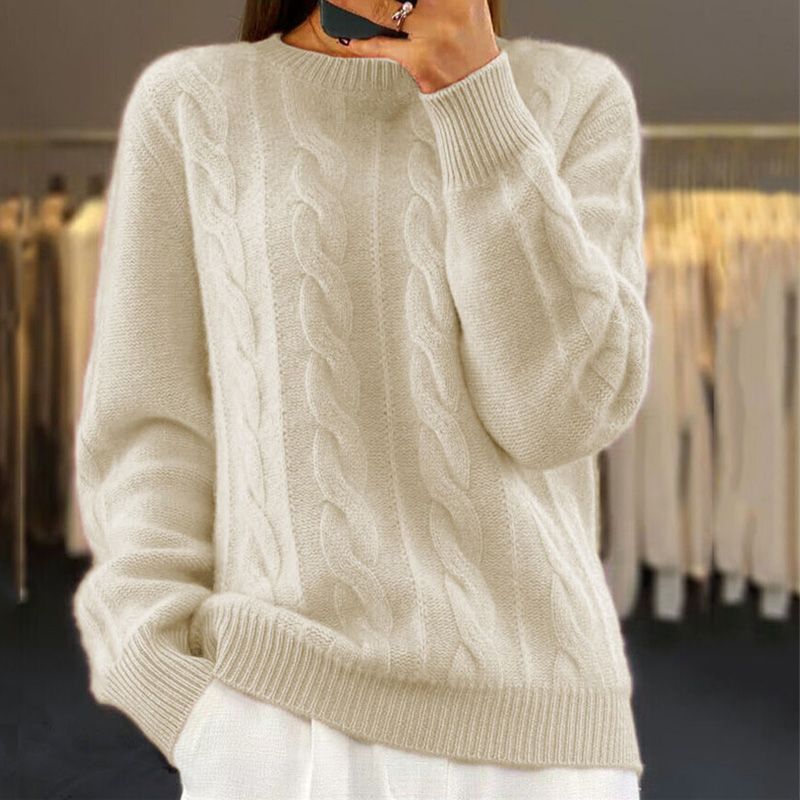 Off-white cable-knit winter sweater with crew neck, ribbed cuffs, and hem