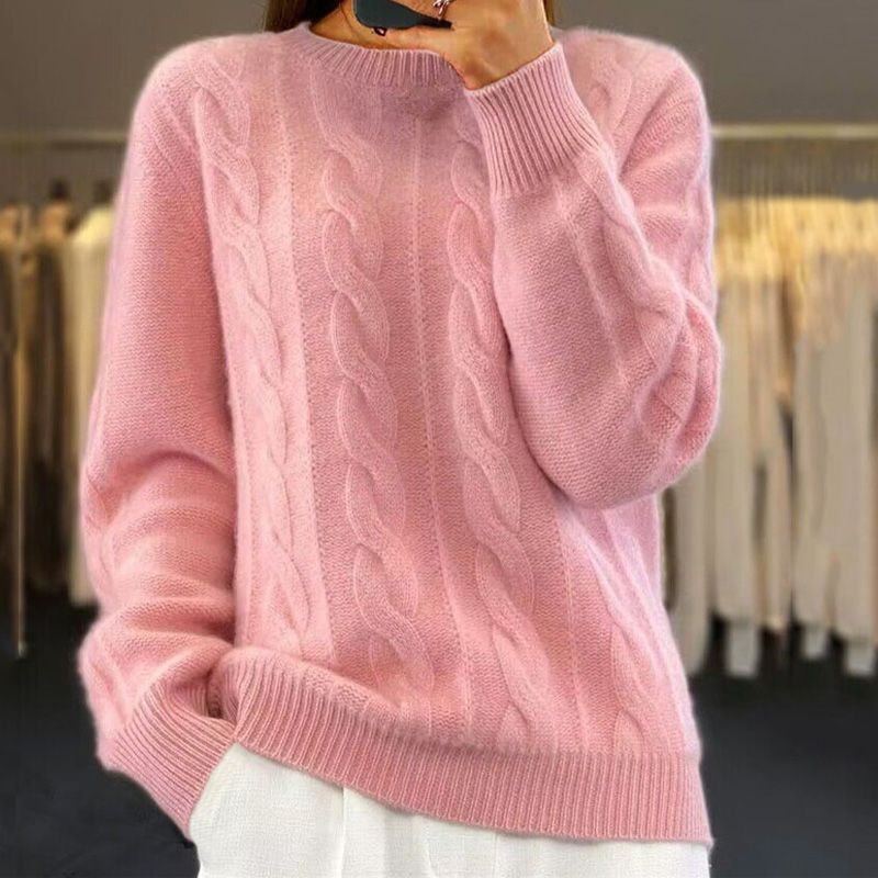 Pink cable-knit winter sweater with crew neck and ribbed cuffs and hem