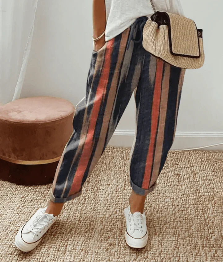 Striped retro pants in dark navy with vertical red and gray stripes, relaxed fit