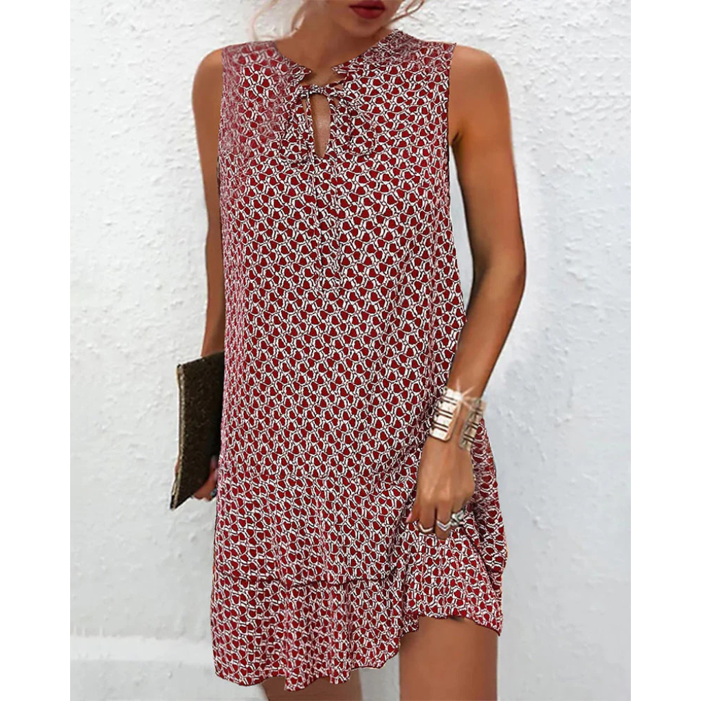 Red patterned sleeveless dress front with keyhole neckline and short tiered hem