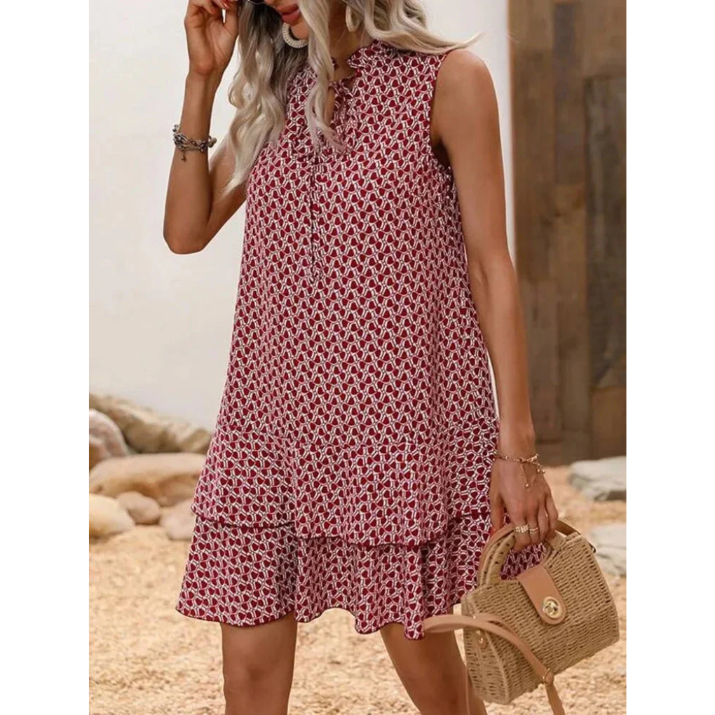 Red patterned sleeveless summer dress with keyhole neckline and flared tiered skirt
