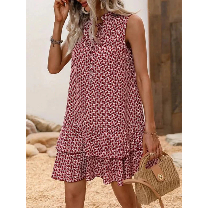Red patterned sleeveless summer dress with keyhole neckline and flared tiered skirt
