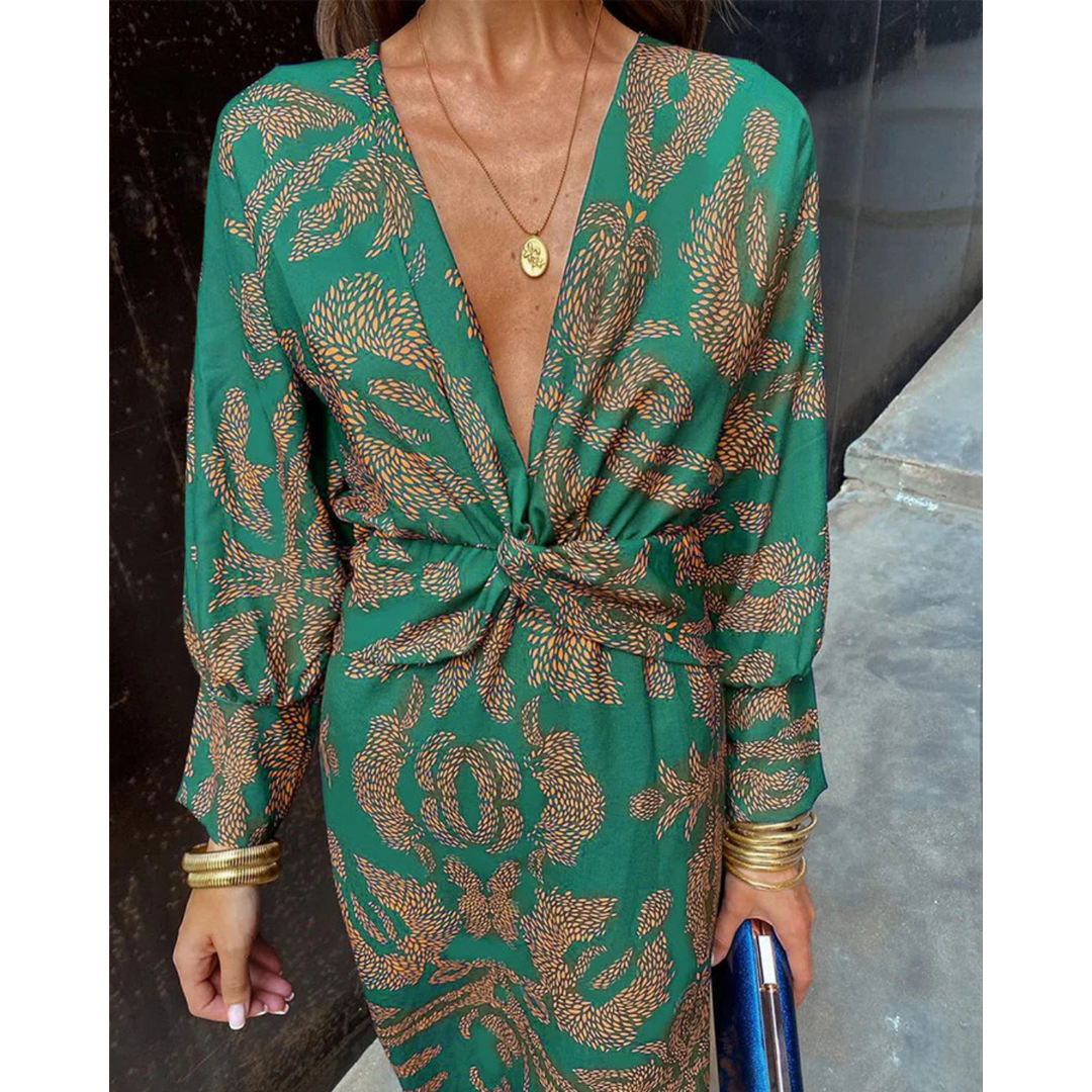 Boho elegance dress close-up in green with gold print, deep V-neck, knotted waist