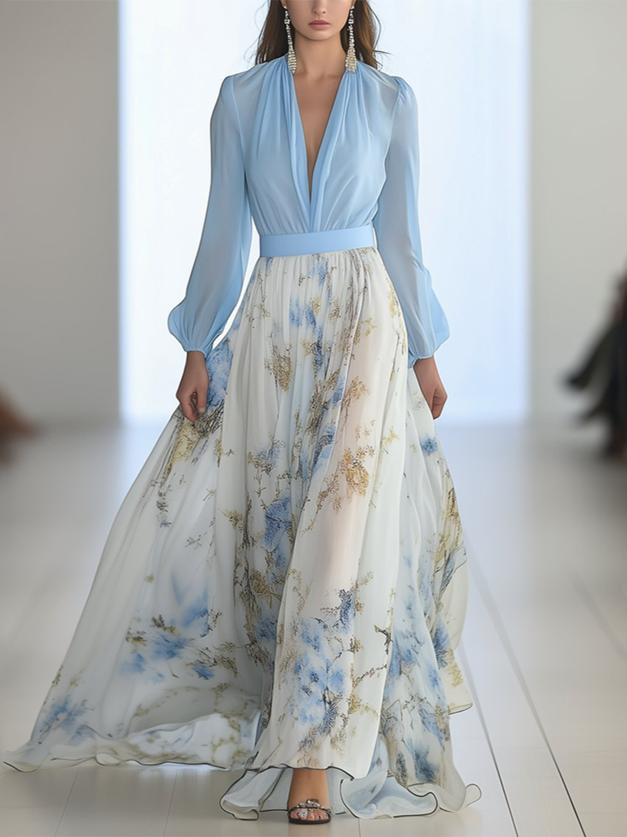 Long-sleeve light blue V-neck maxi dress with gathered waist and floral skirt