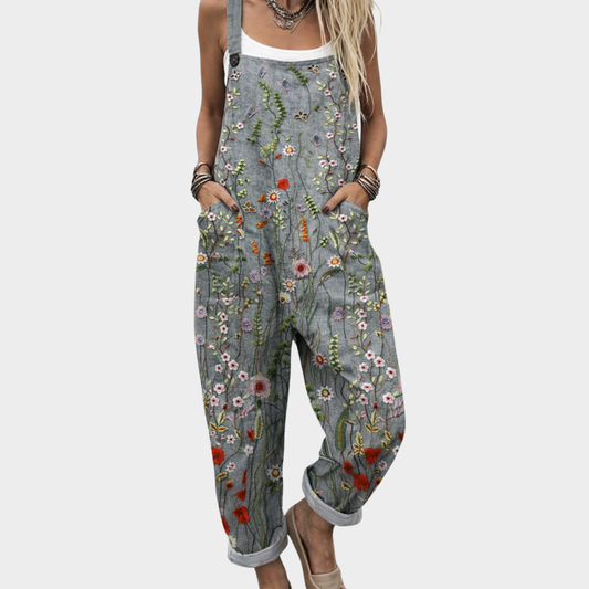 Gray floral printed overalls with adjustable bib and relaxed straight legs