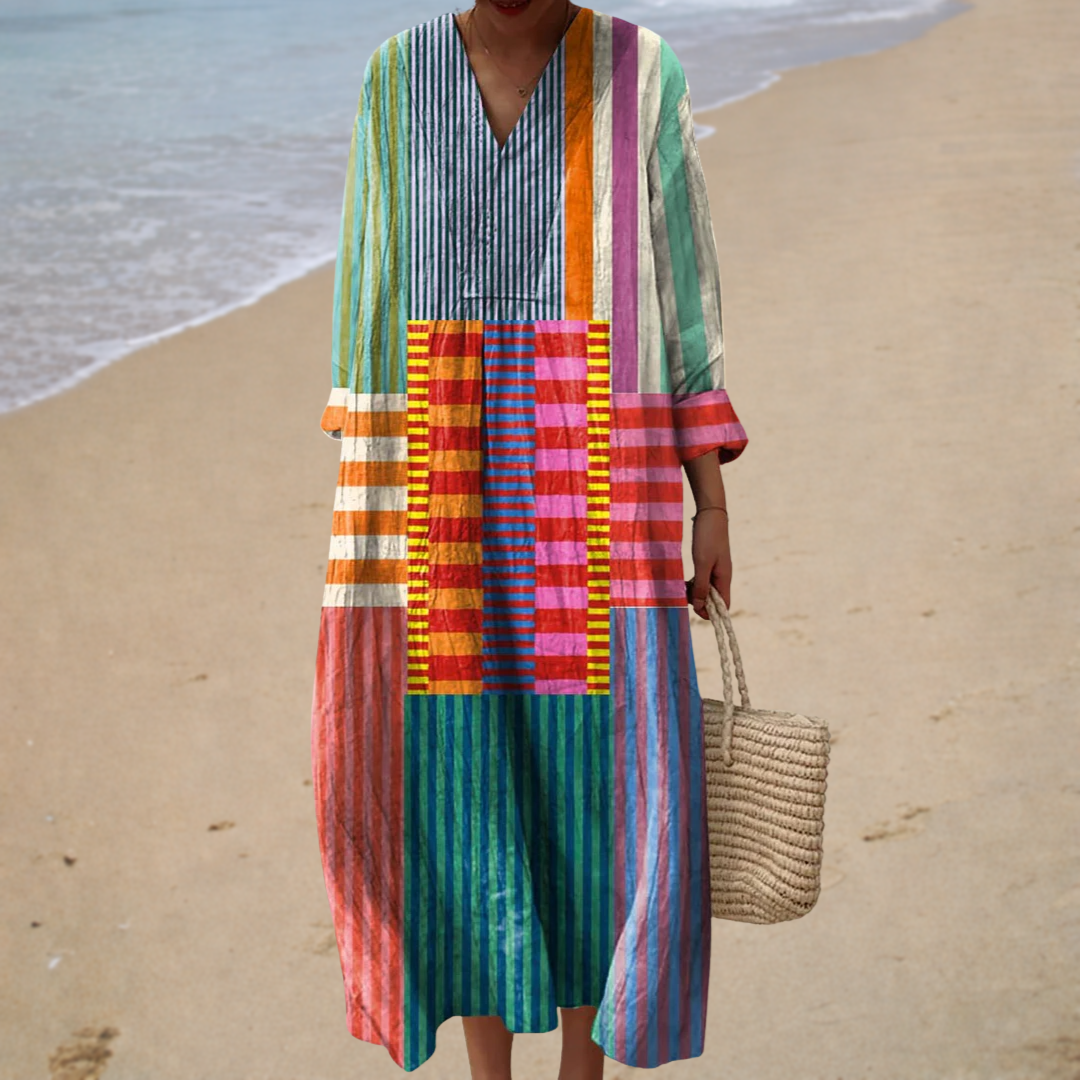 Multicolor printed summer dress with V-neck and patchwork stripe pattern, midi length.