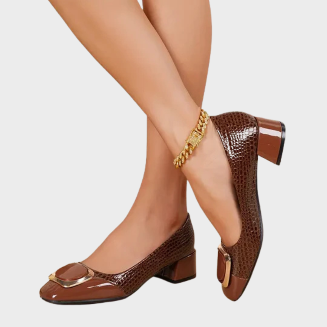 Brown leather loafers with glossy toe cap, gold buckle, and mid block heel