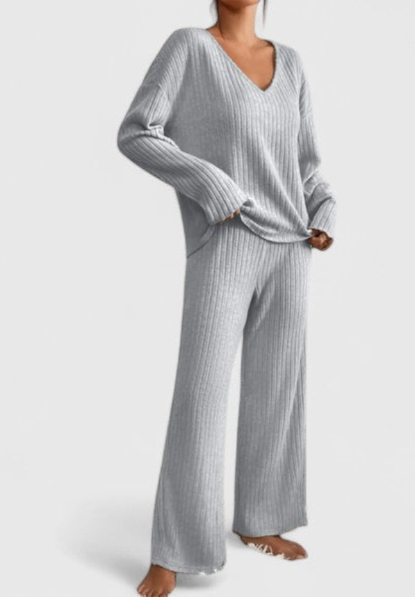 Grey ribbed v-neck sweater and wide-leg pants set with matching ribbed texture.