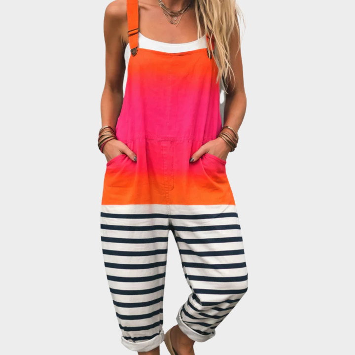 Printed overalls with orange bib, pink-to-orange body, striped navy-and-white legs