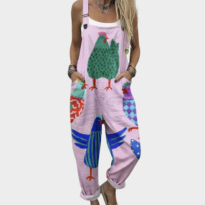 Pink printed overalls with colorful bird and farm scene, adjustable straps, loose fit
