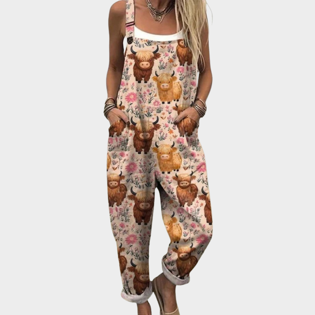Multicolored printed overalls with animal and flower motifs, sleeveless bib front.