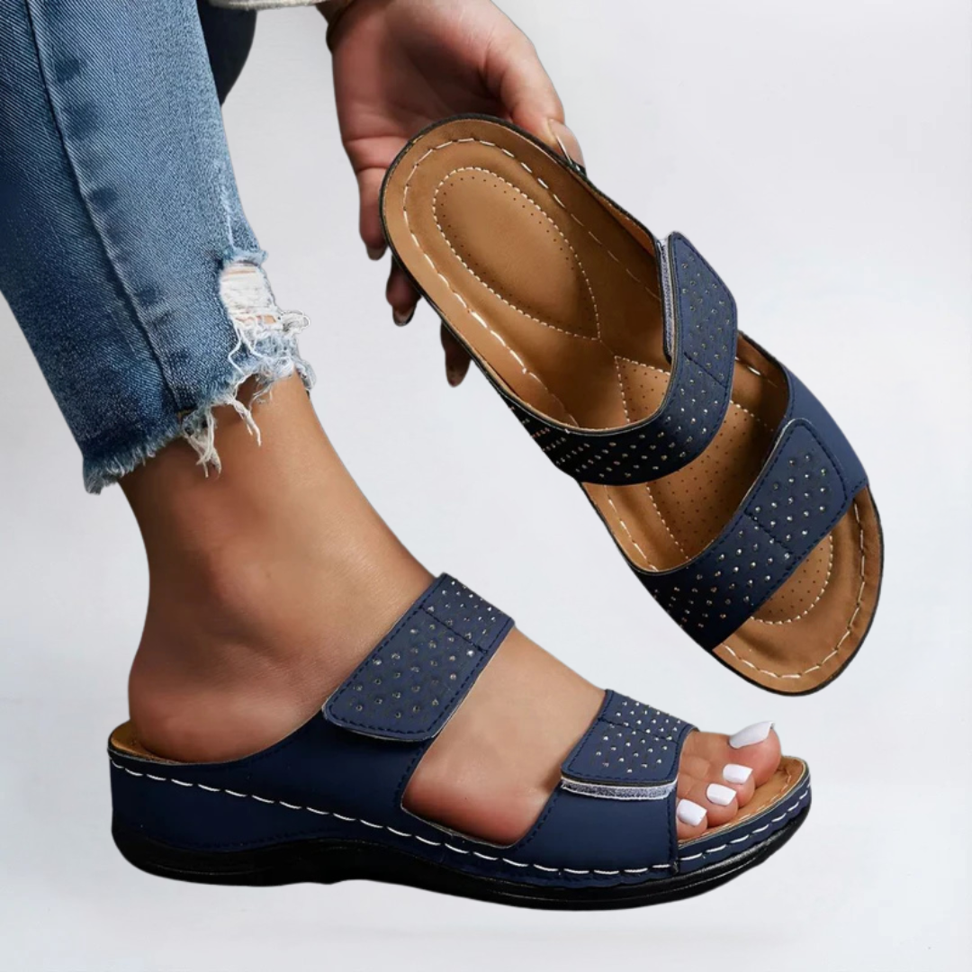 Blue orthopedic sandals with perforated double straps and adjustable hook-and-loop closure