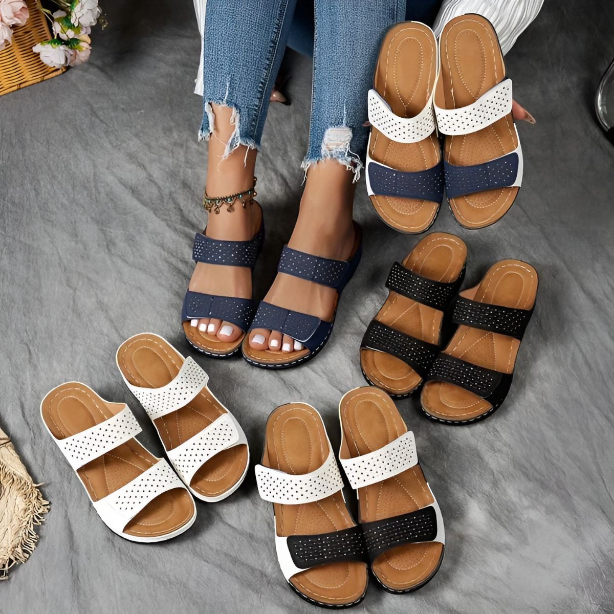 Set of orthopedic sandals in white, black, and navy with perforated strap details