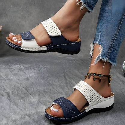 Navy and white orthopedic sandals with perforated straps and hook-and-loop closures