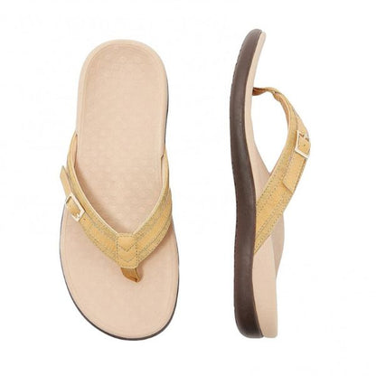 Tan orthopedic sandals with toe thong and adjustable ankle strap, cushioned footbed.