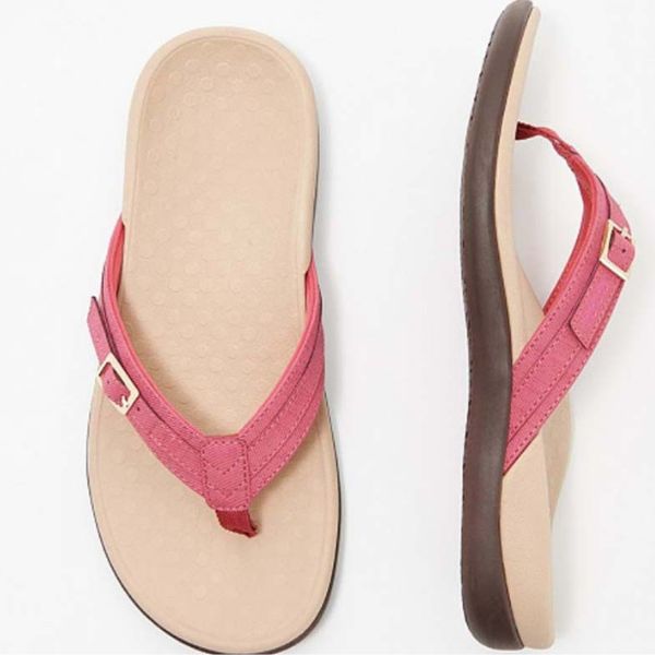 Pink orthopedic sandal with ankle strap and buckle, open toe