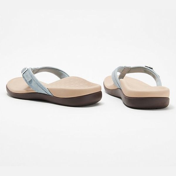 Pair of light blue orthopedic sandals with toe thong and adjustable ankle strap.