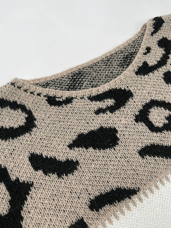 PANTHERA™ leopard print knit sweater with black spots on a light knit and rounded neckline