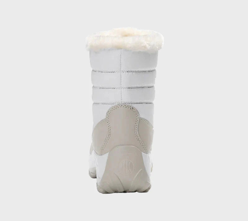 White winter boots with lace-up closure, ankle faux-fur lining, and rugged outsole.