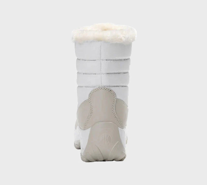 White winter boots with lace-up closure, ankle faux-fur lining, and rugged outsole.